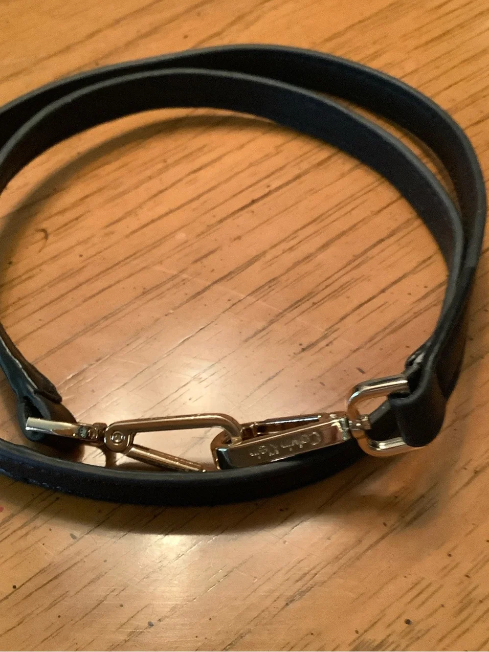 Calvin Klein Gold and Black Purse Strap with goldstone clips.